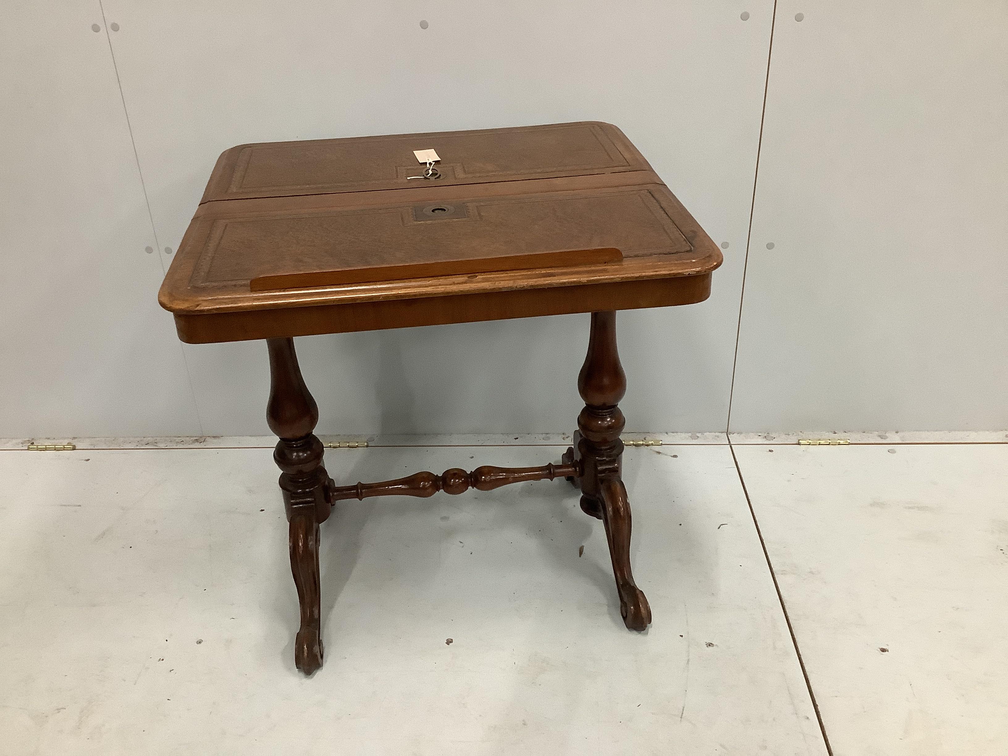 A reproduction Victorian style mahogany reading table with twin hinged flap top, width 70cm, depth 64cm, height 72cm